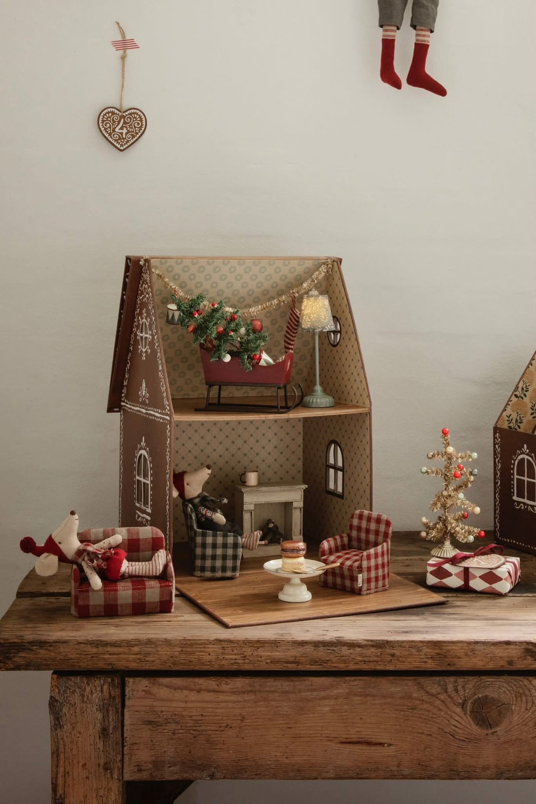 Christmas mouse house scene with a tree, sleigh and miniature furniture