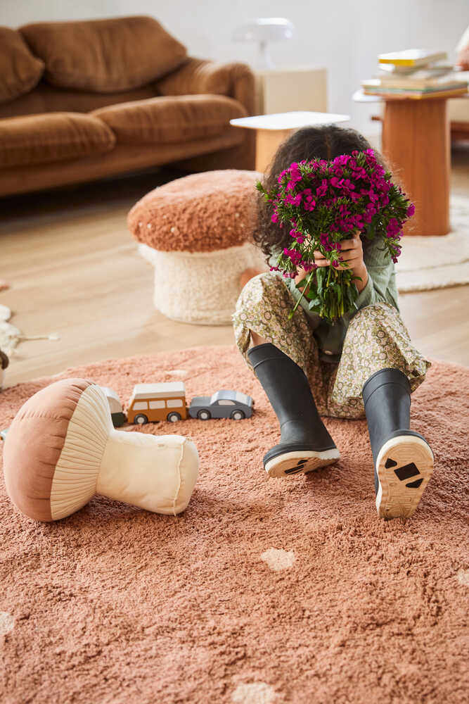 Lorena Canals Boletus mushroom cushion in a cozy kids room