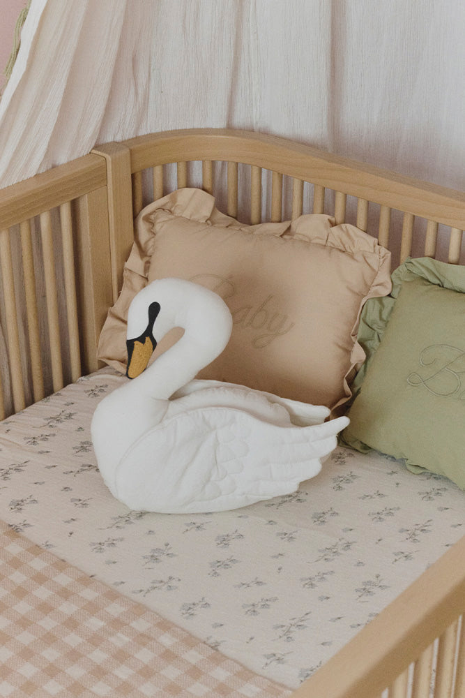 Lorena Canals Swan cushion styled in a nursery