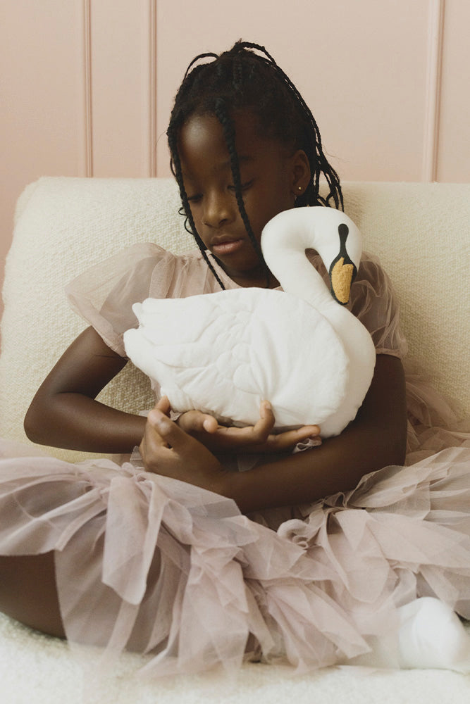 Lorena Canals Swan cushion shown in a children’s room